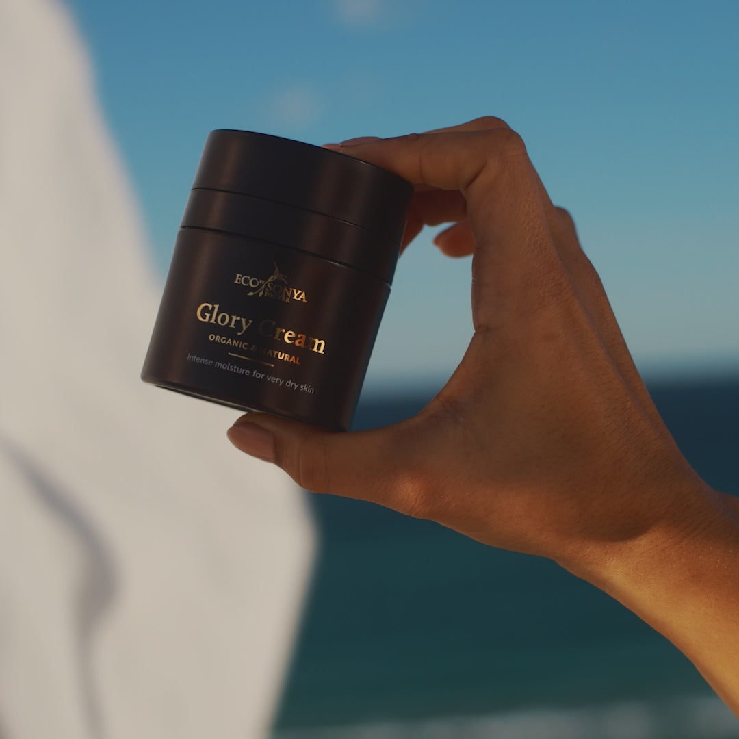 Woman pumping out and applying Eco by Sonya Glory Cream rich moisturiser in her face